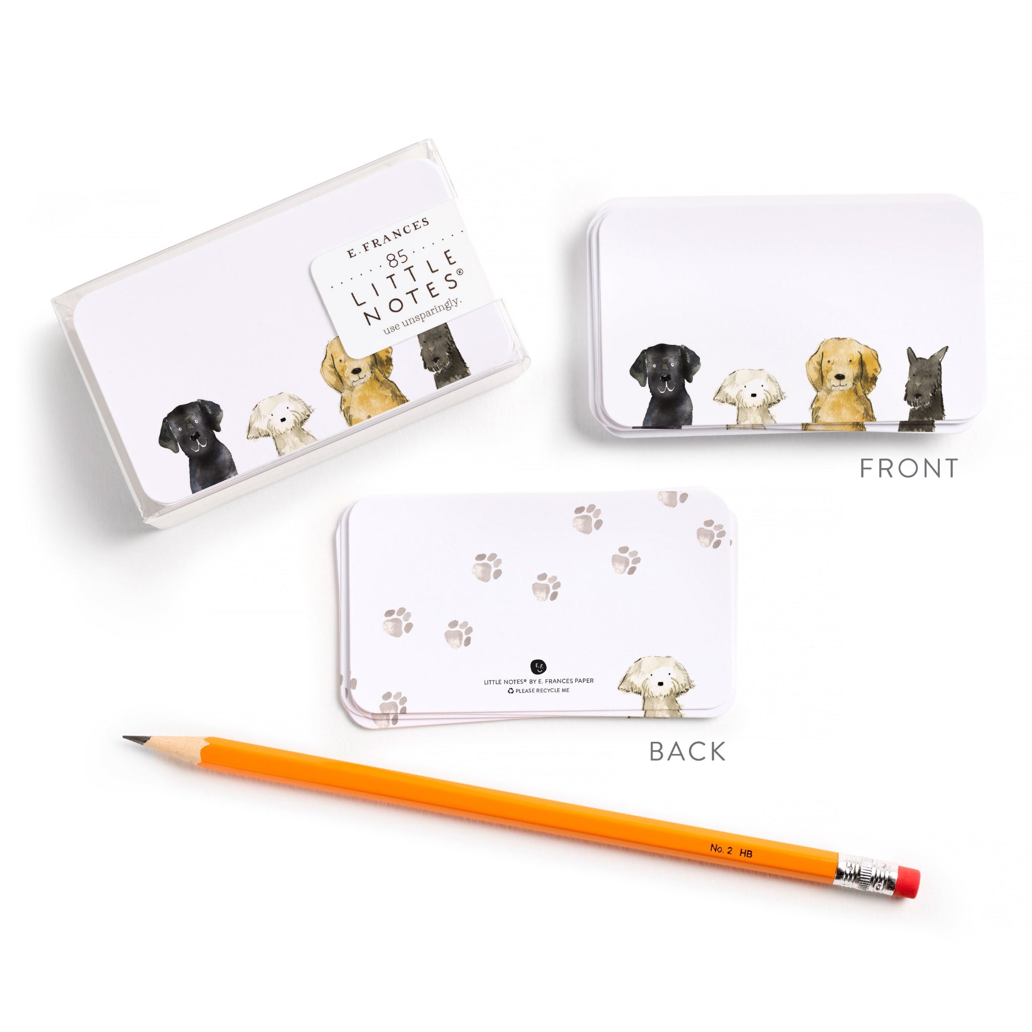 Set of dog-themed little notes with a pencil on a white background.