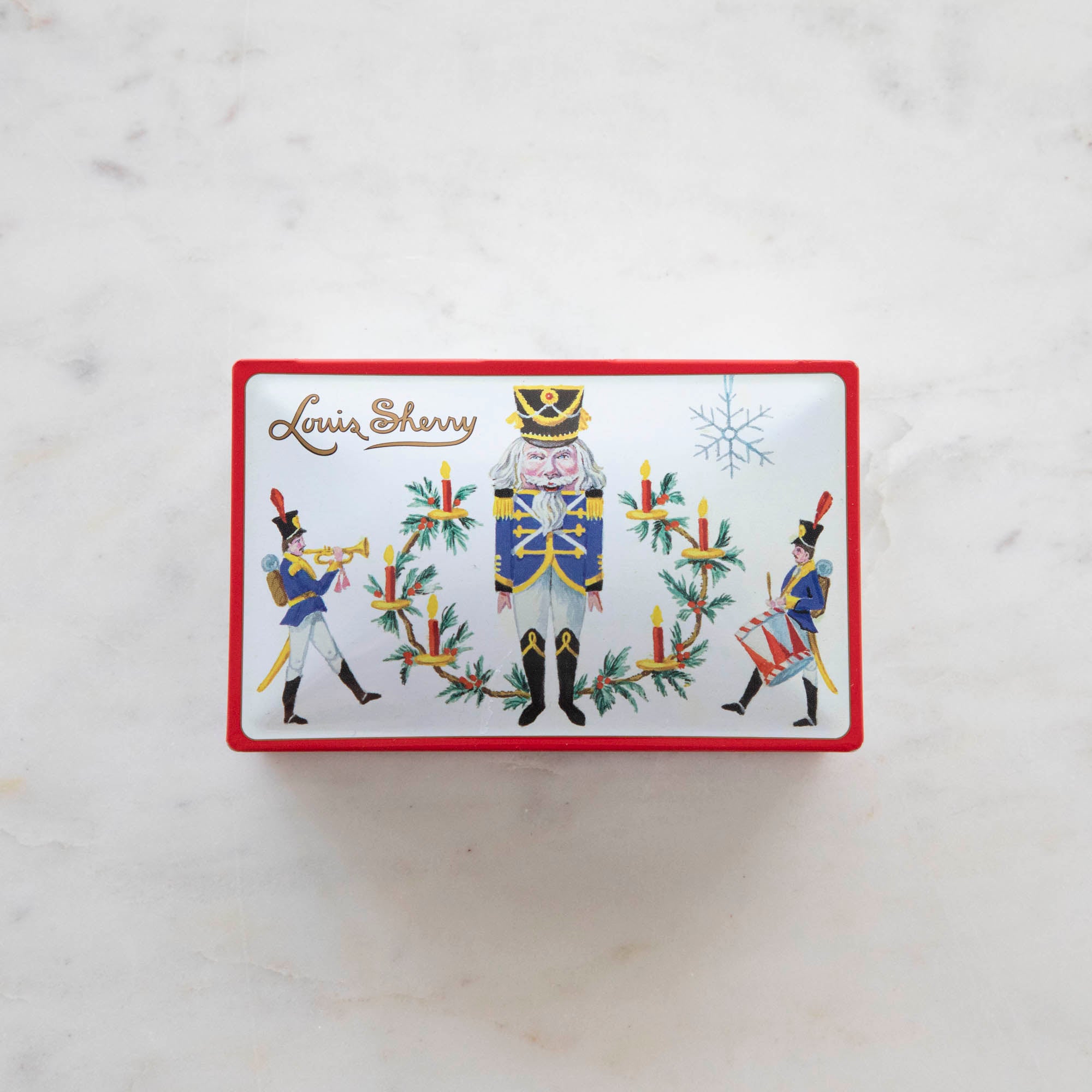 Tin Louis Sherry chocolate box featuring illustrated nutcracker soldiers.