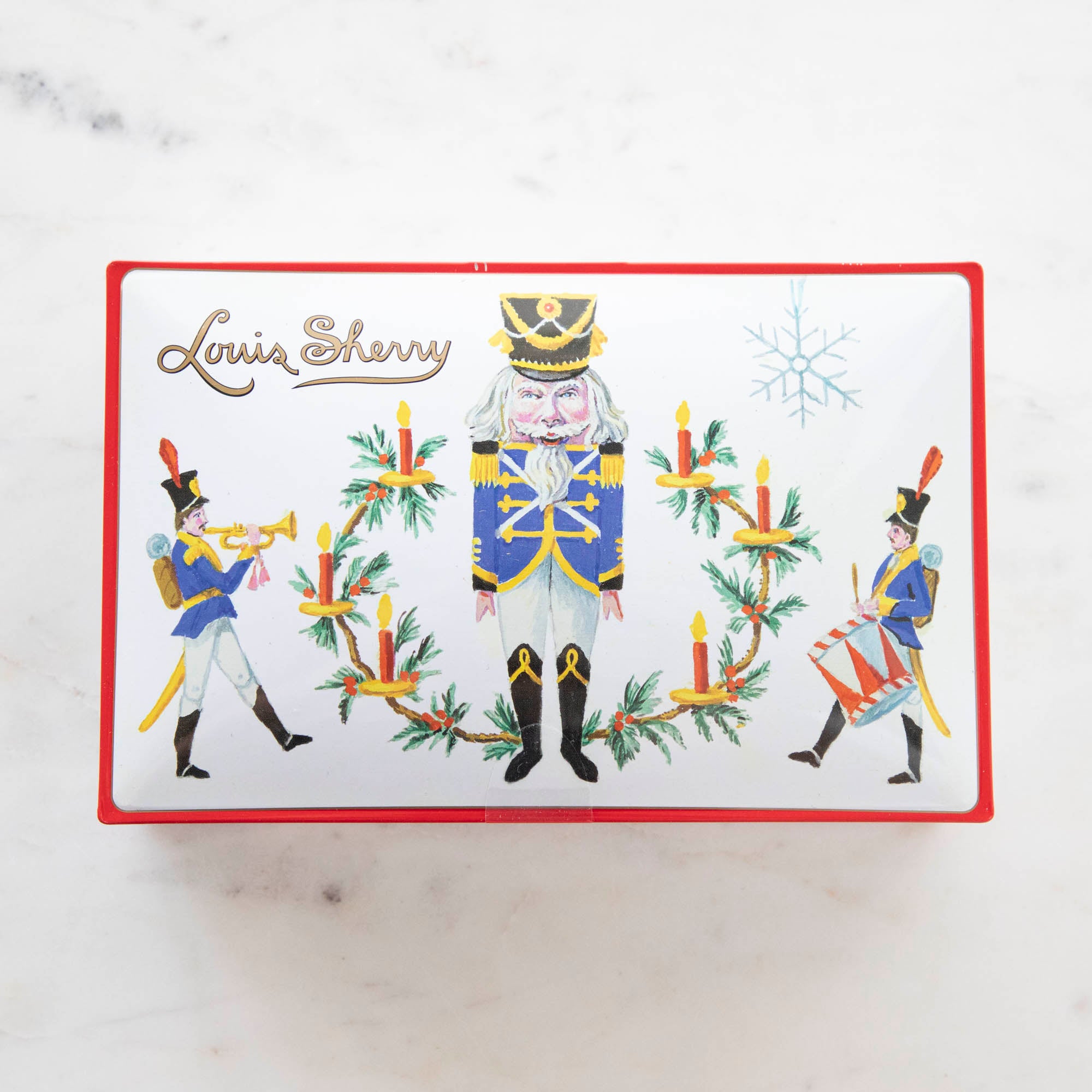 Tin Louis Sherry chocolate box featuring illustrated nutcracker soldiers.