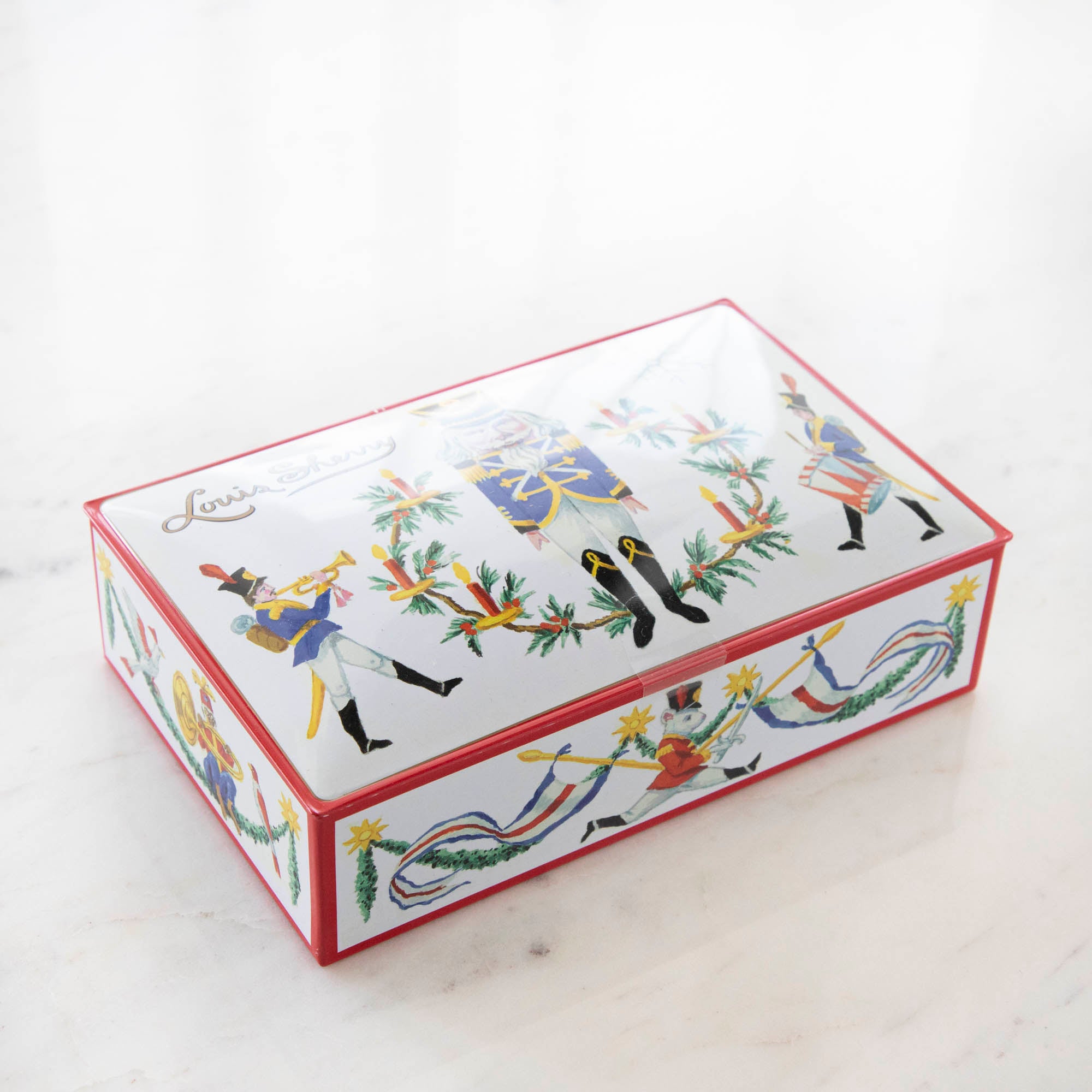 Tin Louis Sherry chocolate box featuring illustrated nutcracker soldiers.