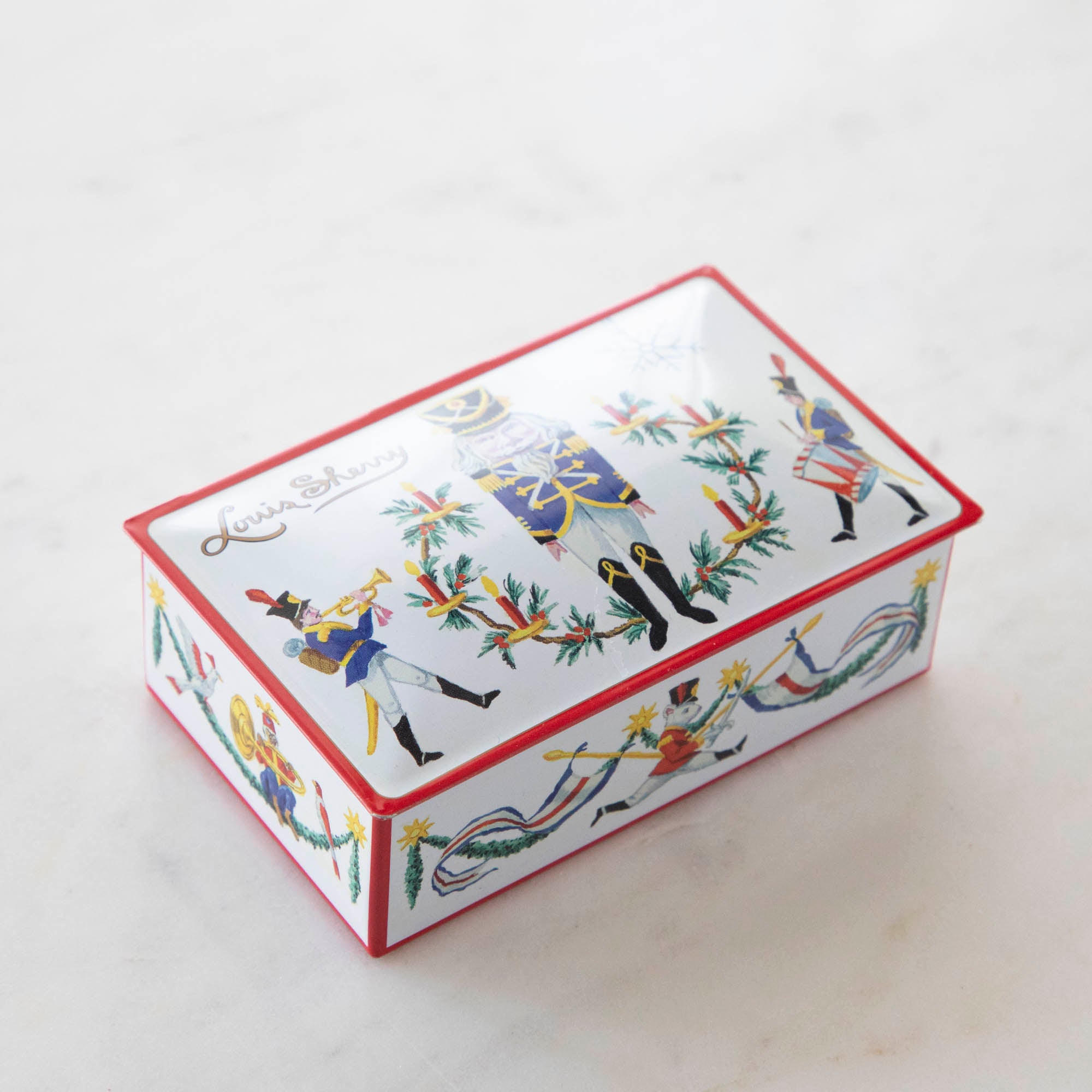 Tin Louis Sherry chocolate box featuring illustrated nutcracker soldiers.