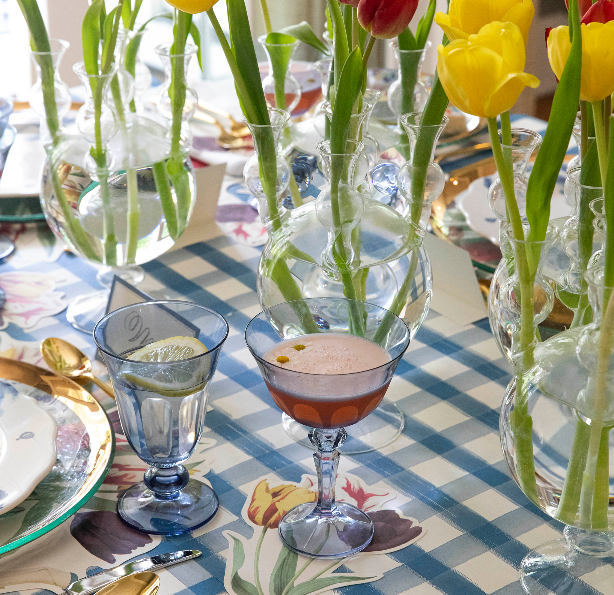 A group of Tulipiere Vases by HomArt on a table.