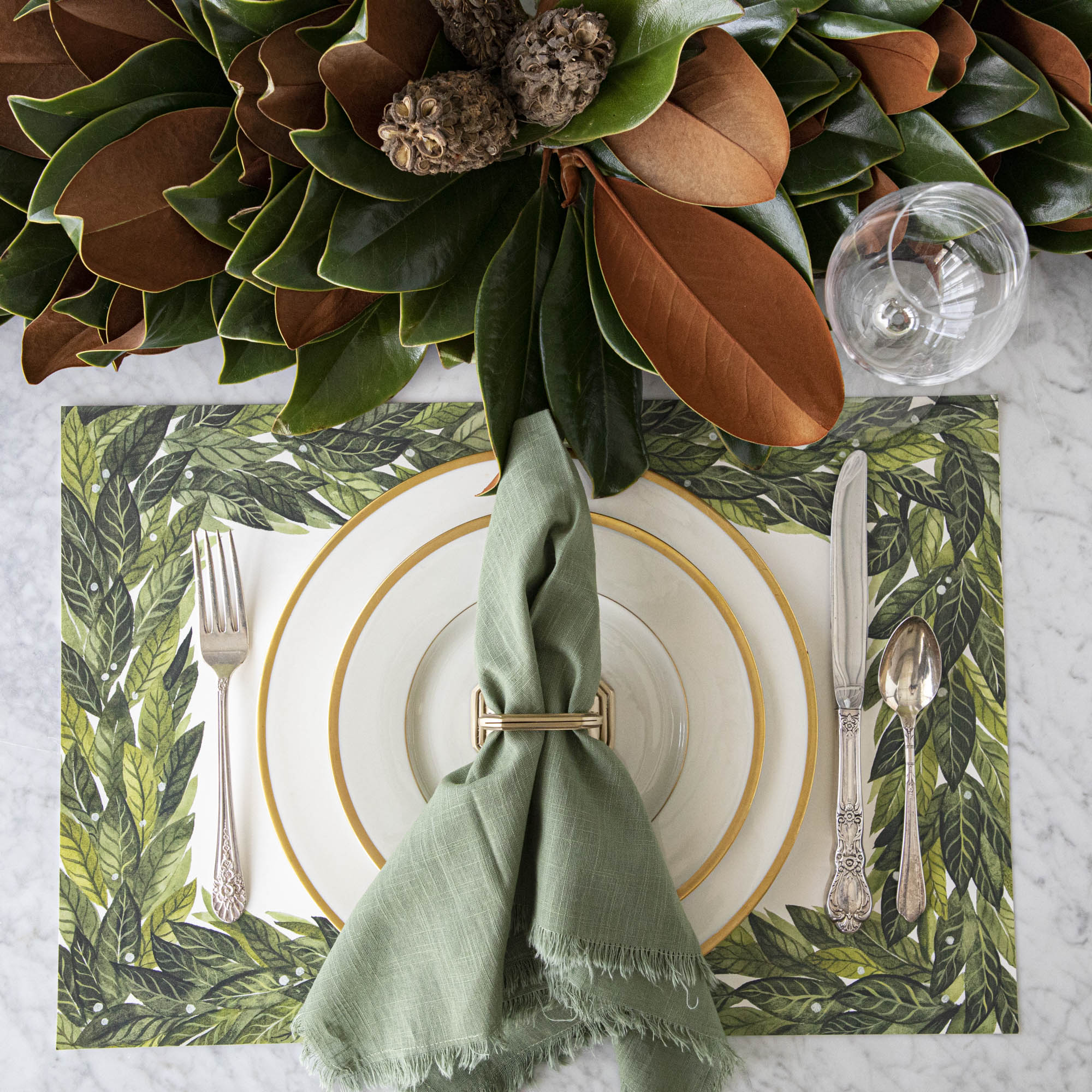 Magnolia centerpiece styled on a table.