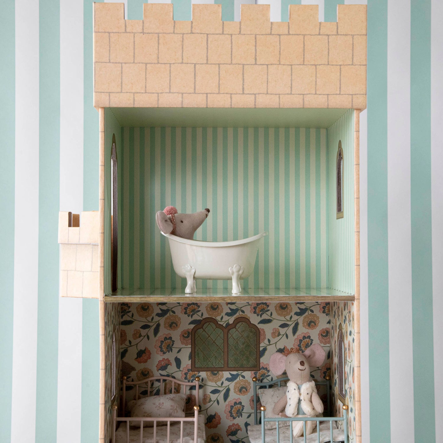 A doll house with a Mouse Bathtub in a vintage bath tub by Maileg.
