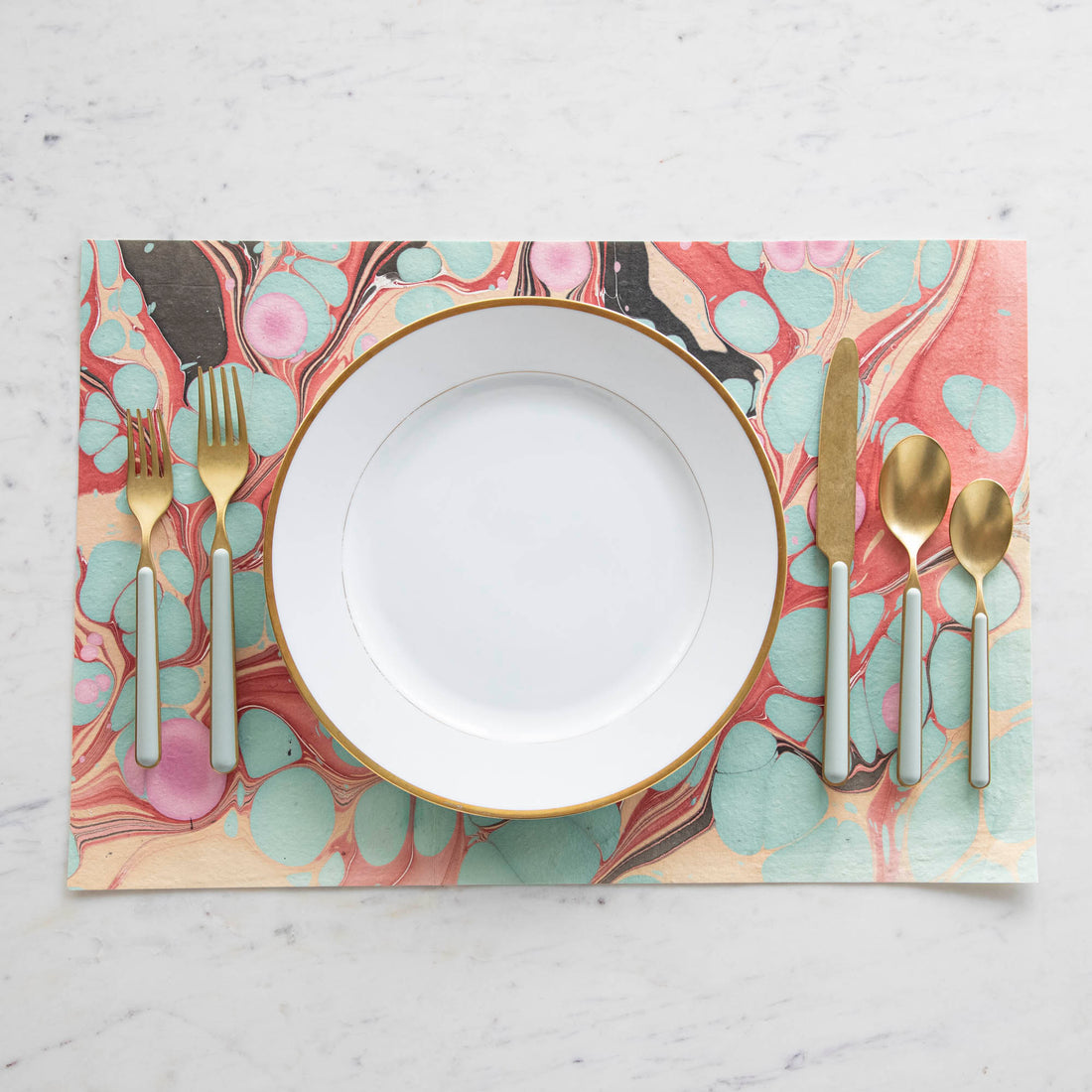 Fantasia Sage 5-Piece Place Setting by Mepra arranged on a marble surface.
