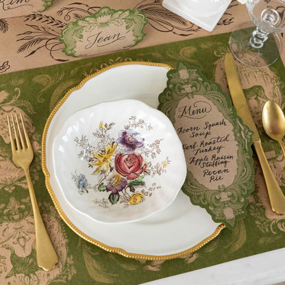 The Moss Fable Toile Placemat under an elegant place setting.