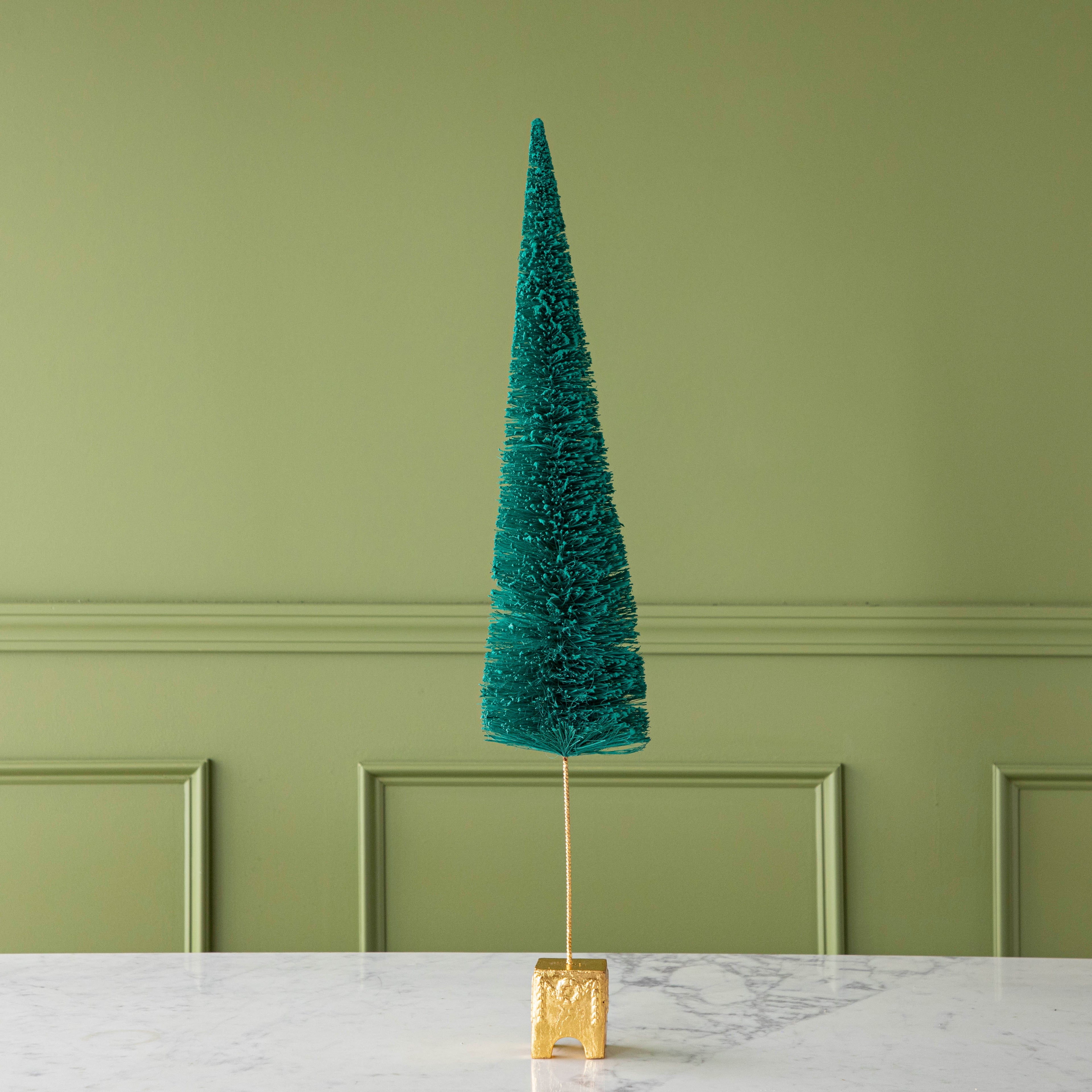 A 29" Dark Green Forest Sisal Tree with a gold base, on a marble table.