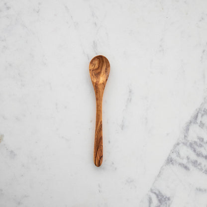 A set of nonporous Natural Olivewood Olivewood Spoons with lemons and salt.