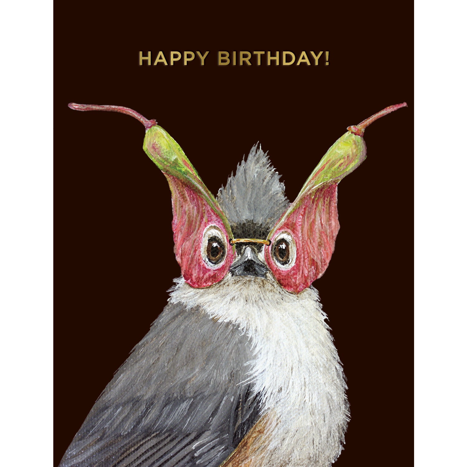 A dark brown greeting card featuring a charming illustrated portrait of a songbird wearing a mask made of seed pods, with the words "HAPPY BIRTHDAY!" printed in gold foil across the top of the card.