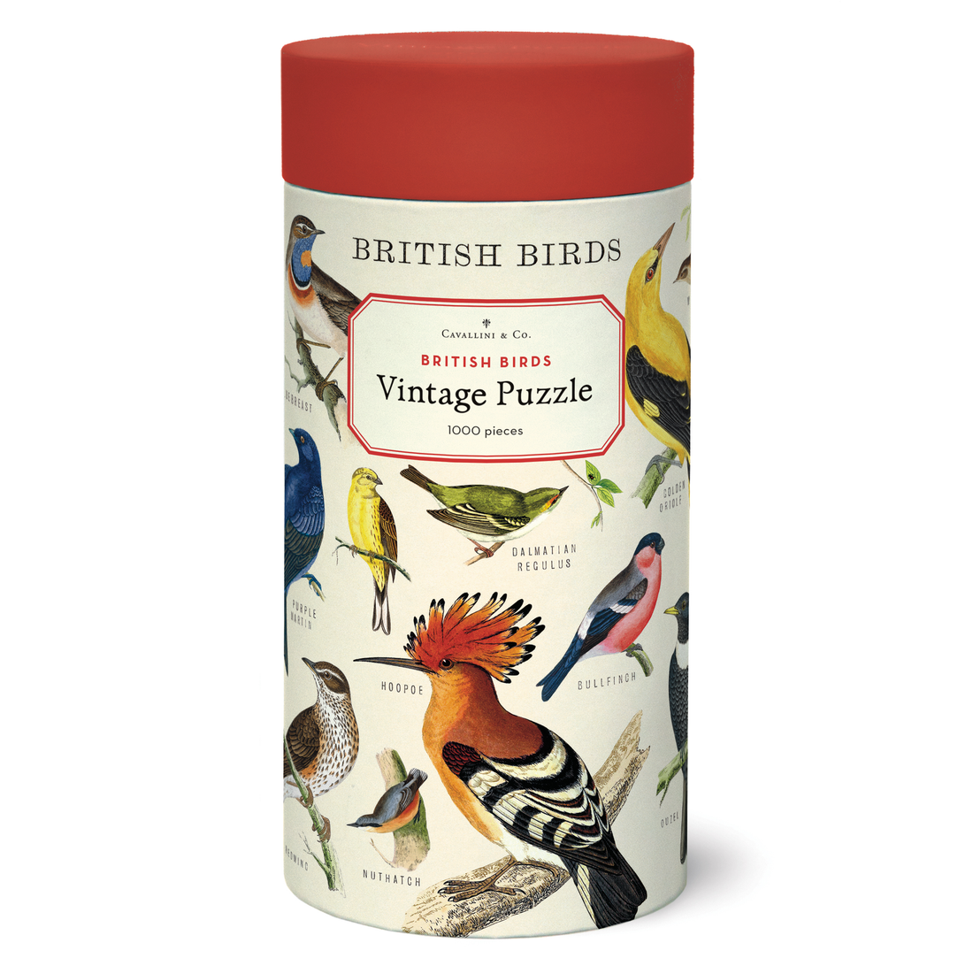 A cylindrical puzzle box labeled &quot;British Birds Puzzle&quot; from the Cavallini Papers &amp; Co archives, with illustrations of various bird species on it.