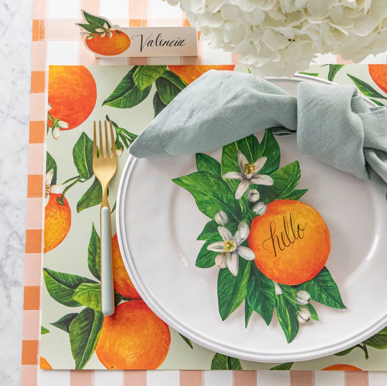 An elegant table setting featuring the Orange Orchard Placemat, Orange Table Accent and Orange Place Card.