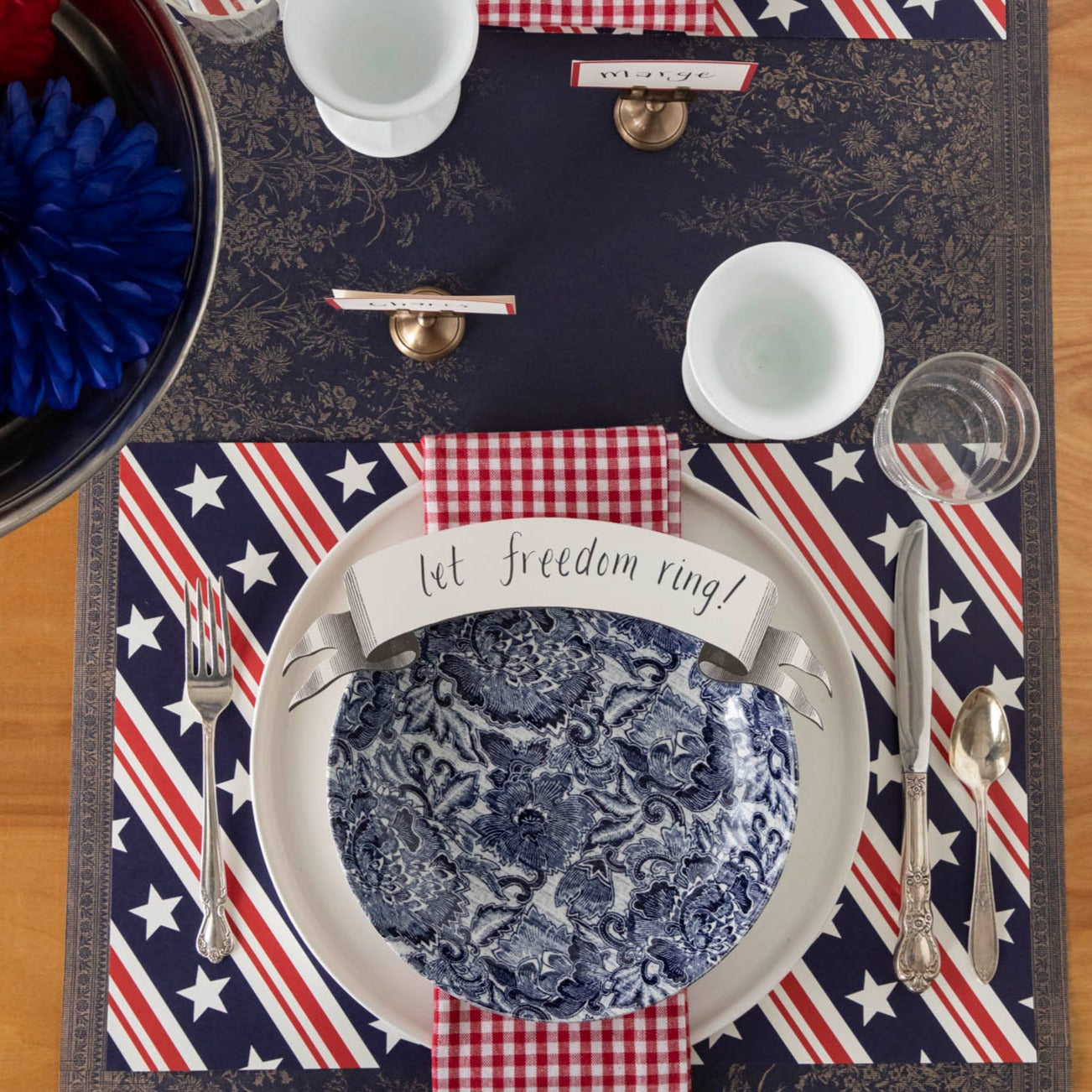 The Stars and Stripes Placemat under a patriotic place setting, from above.