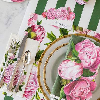Close-up of the Peonies In Bloom Placemat under an elegant place setting.