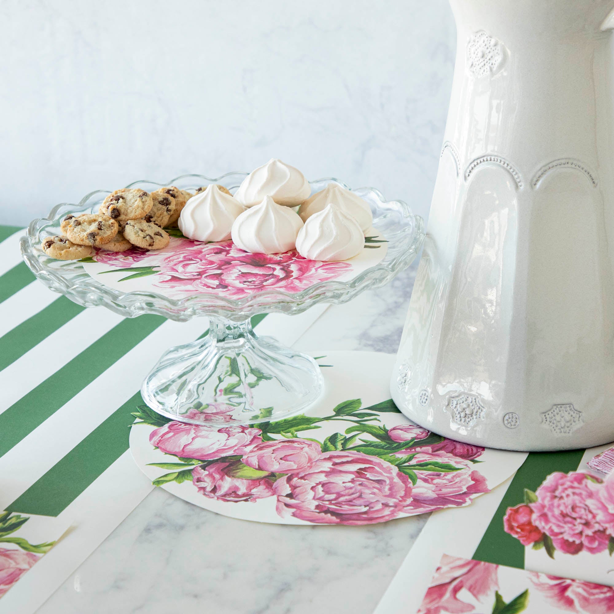 An elegant, floral treat spread featuring Peony Serving Papers under various cookies and treats.