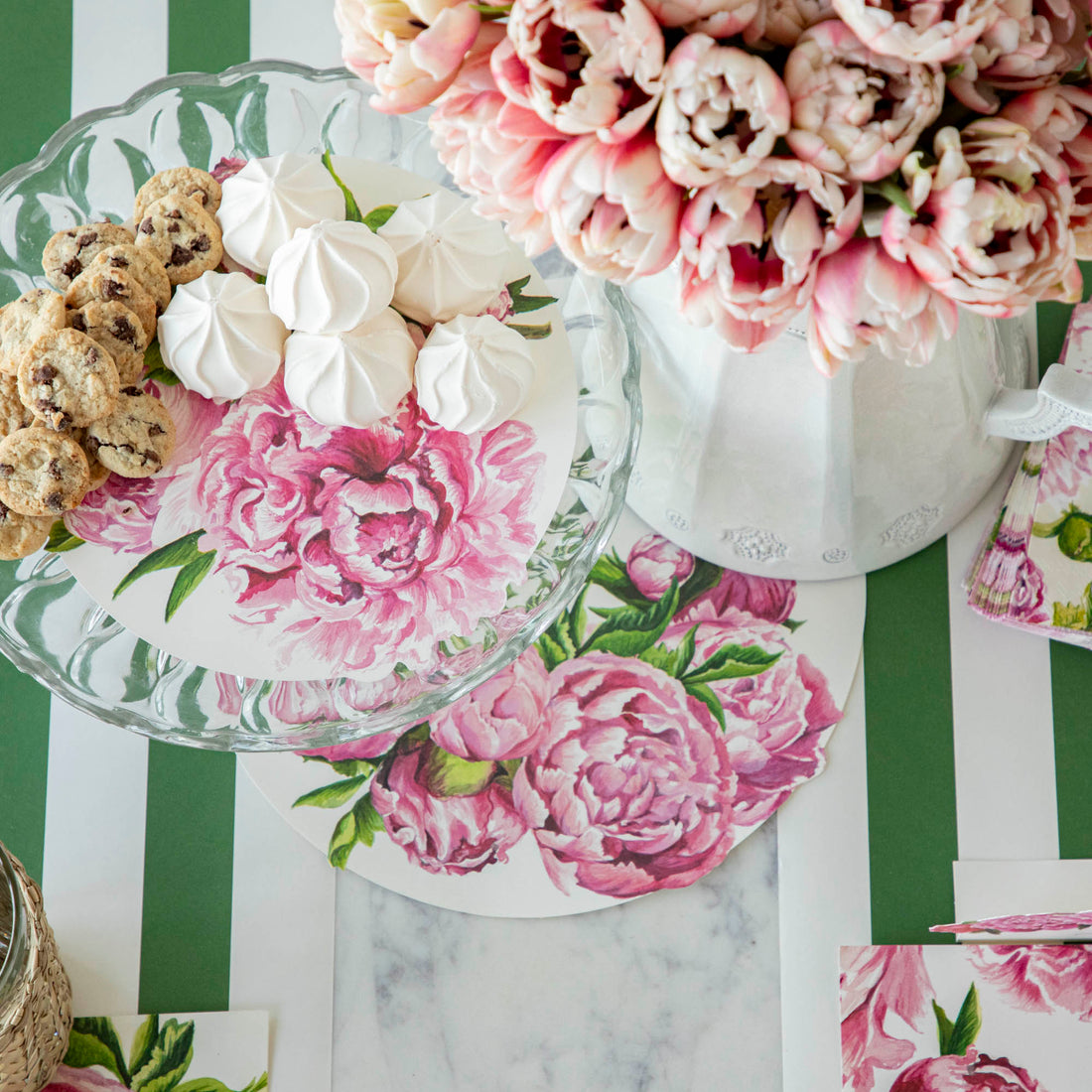 An elegant, floral treat spread featuring Peony Serving Papers under various cookies and treats, from above.