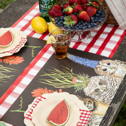 The Baby Owls Placemat used in an outdoor picnic place setting.
