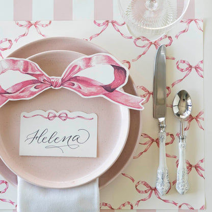 The Pink Bow Lattice Placemat under an elegant place setting, from above.