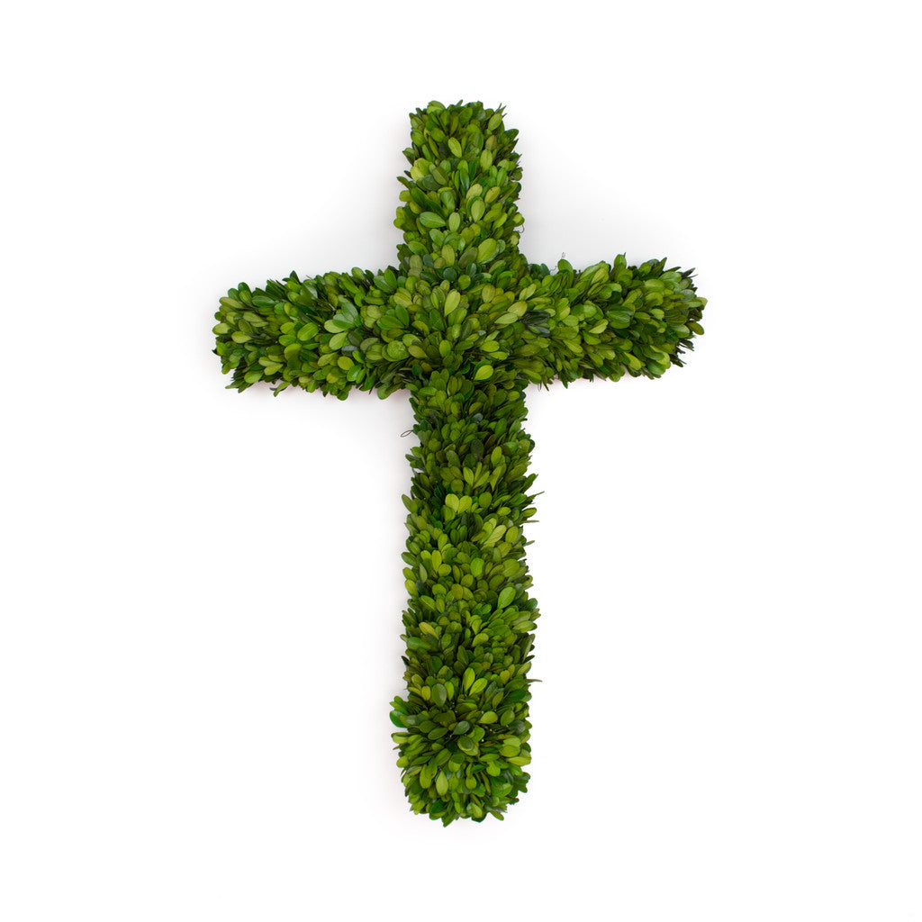 An elegant, Mills Floral Company Preserved Boxwood Cross shaped into a cross and preserved in boxwood, isolated on a white background.