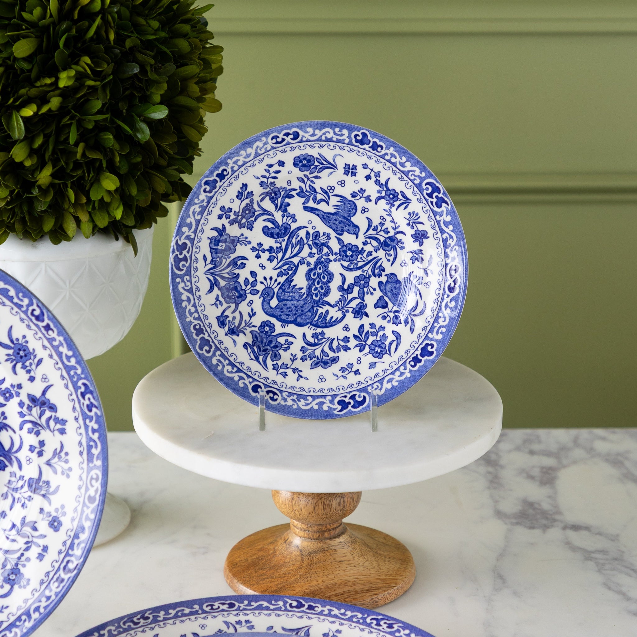 Burleigh Blue Regal Peacock Small Plate on a stand and peddestal.