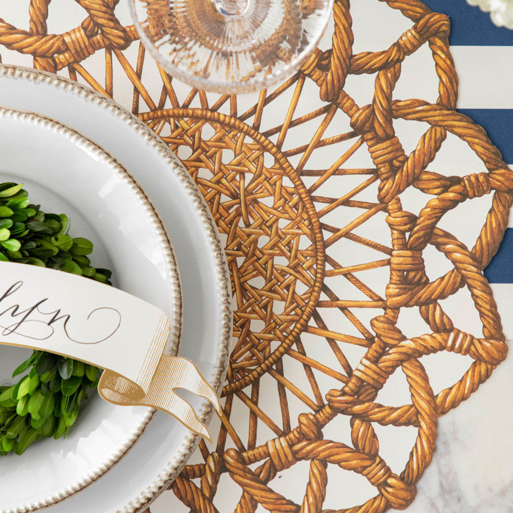 Close-up of the Die-cut Rattan Weave Placemat under an elegant place setting, from above.