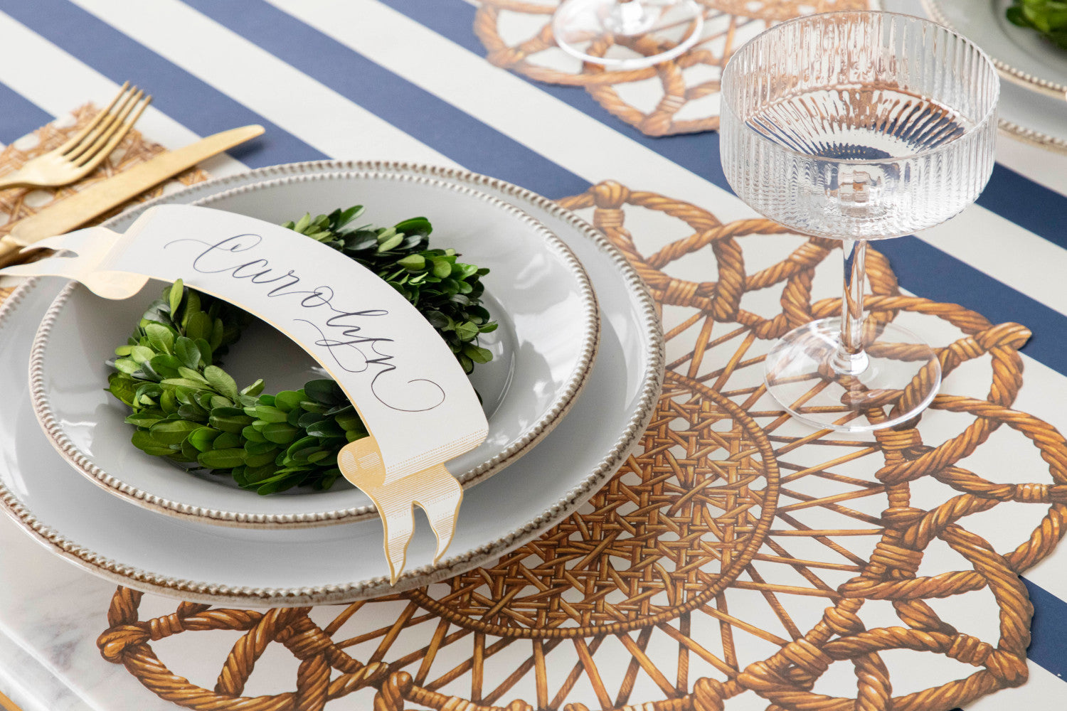 The Die-cut Rattan Weave Placemat under an elegant place setting.