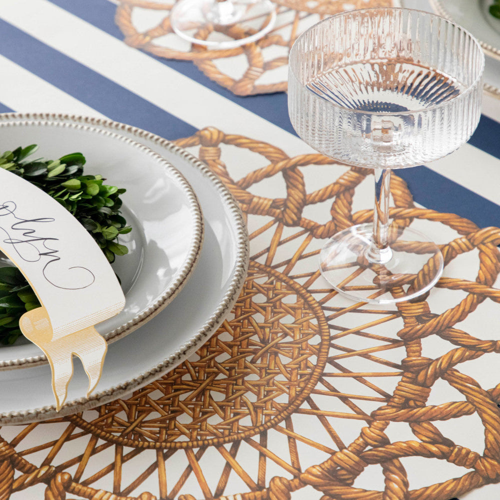 The Die-cut Rattan Weave Placemat under an elegant place setting.