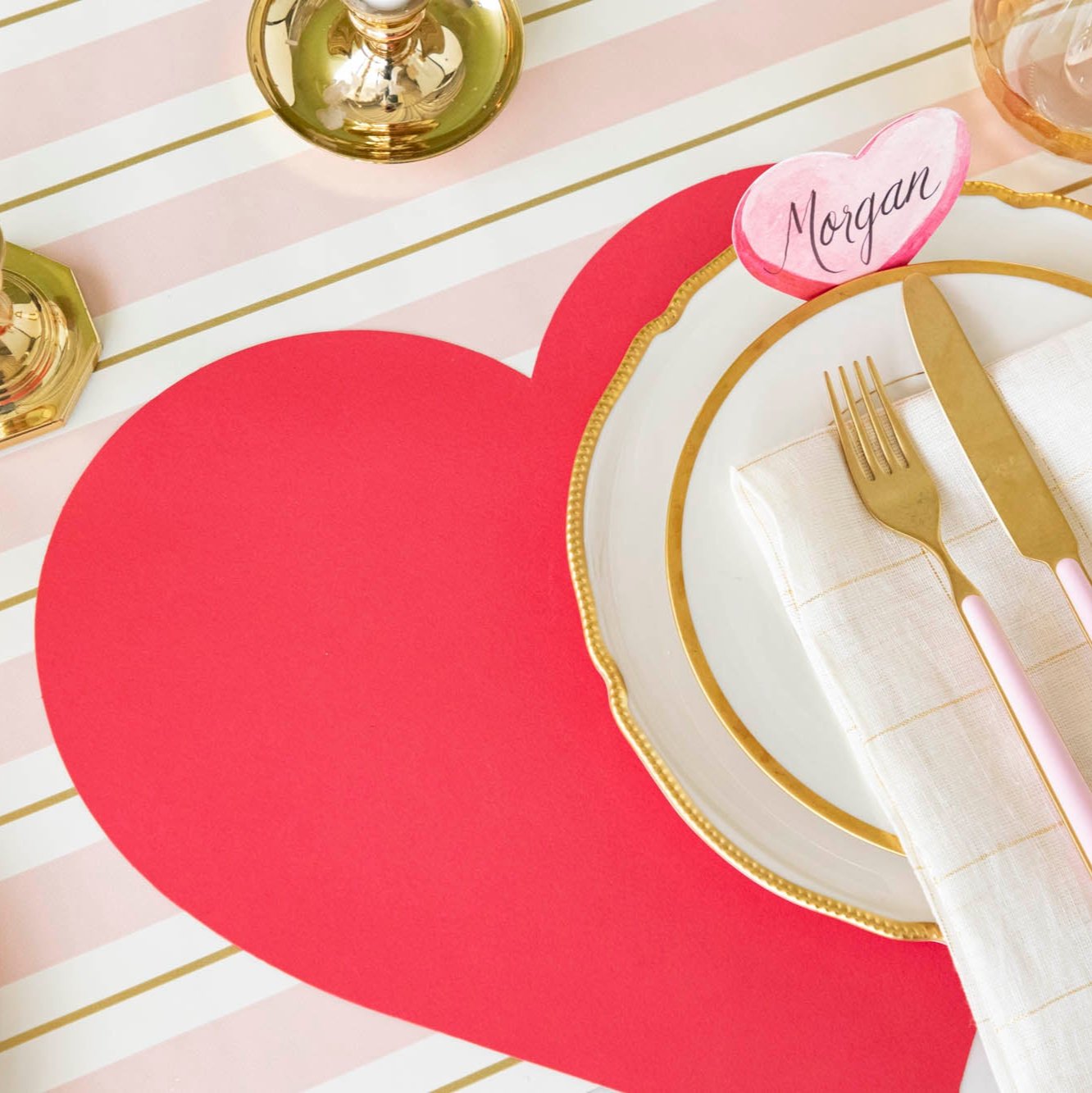An elegant table setting with the Die-cut Heart Placemat on the Pink & Gold Awning Stripe Runner.