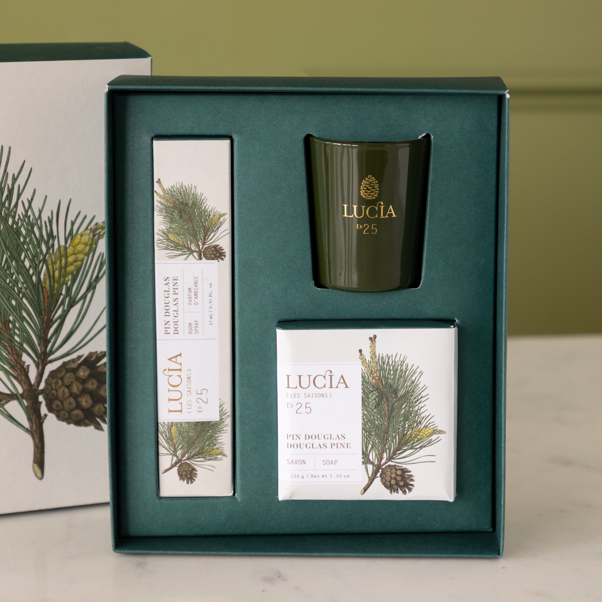 Gift set with candles and packaging featuring the brand Lucia.
