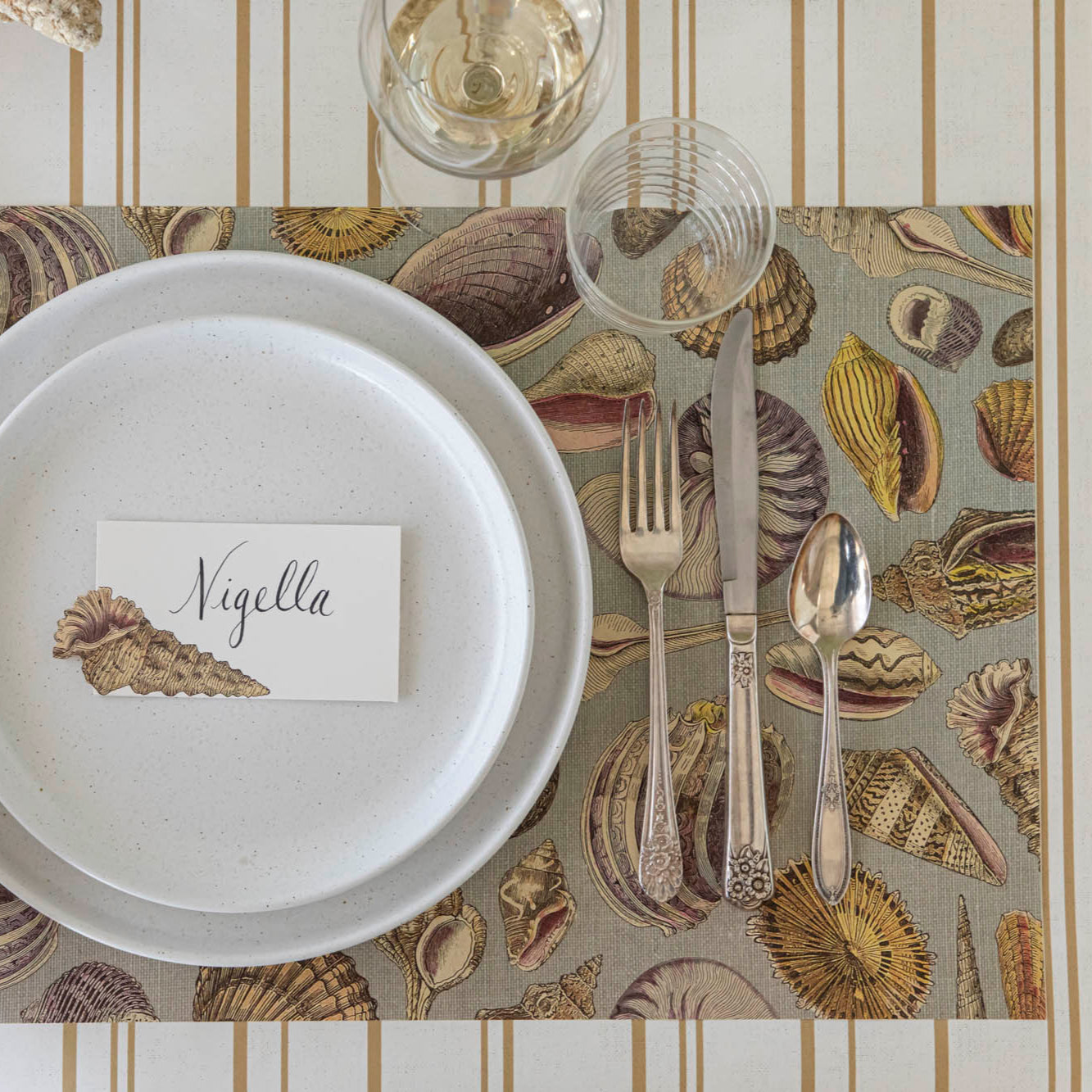 Shell Study Placemat under an elegant place setting on the Antique Gold Stripe Runner.