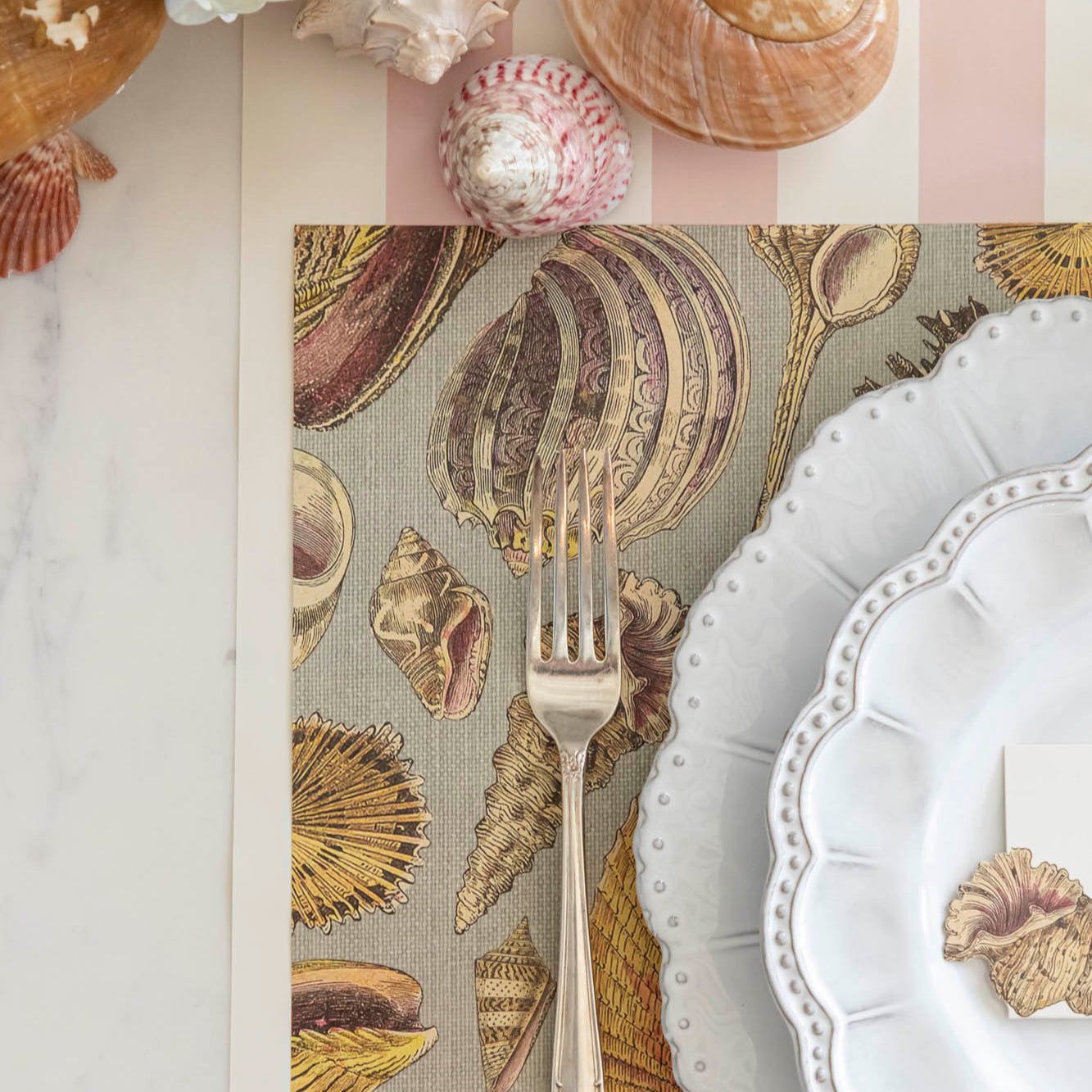 Shell Study Placemat under an elegant place setting on the Pink Classic Stripe Runner.