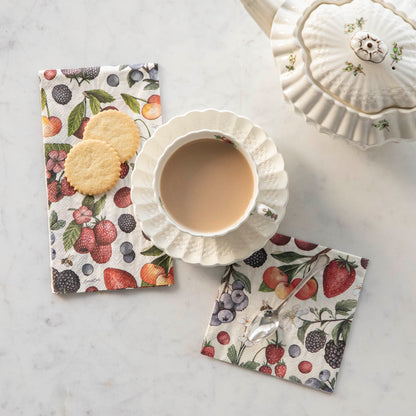 Two Wild Berry Napkins under a cup of coffee and two cookies.