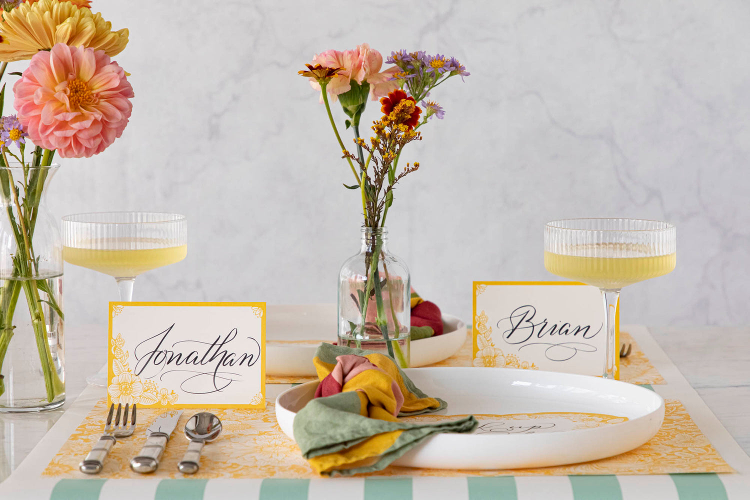An elegant floral table setting featuring Spring Blooms Place Cards at each place.