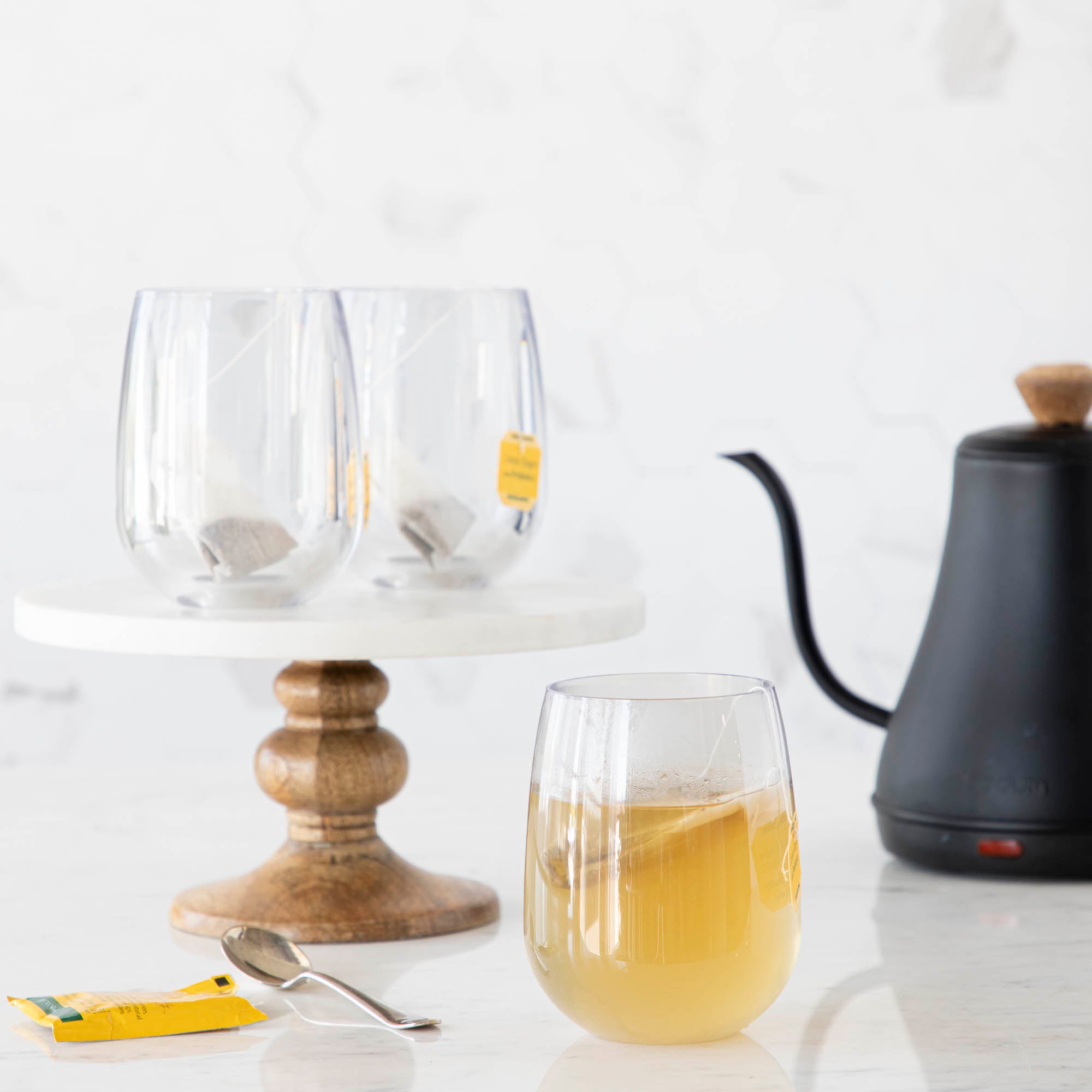 3 Symglasses and a tea kettle in the background.