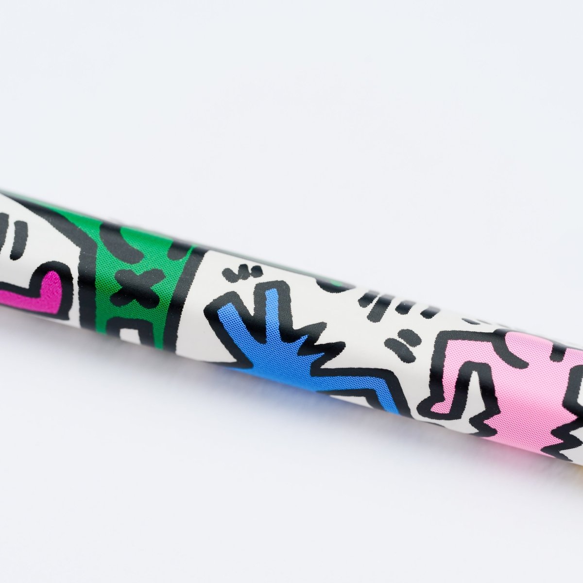 Close up of pencil with Keith Haring artwork.