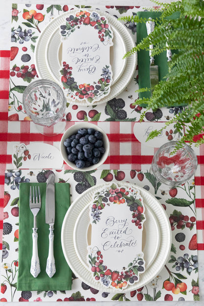 The Wild Berry Placemat under an elegant summertime table setting, from above.