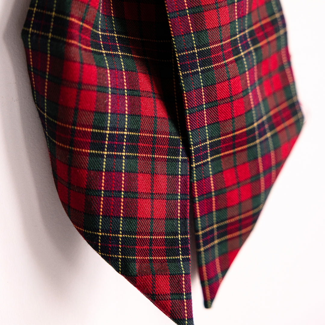 Red and green plaid fabric on a white background