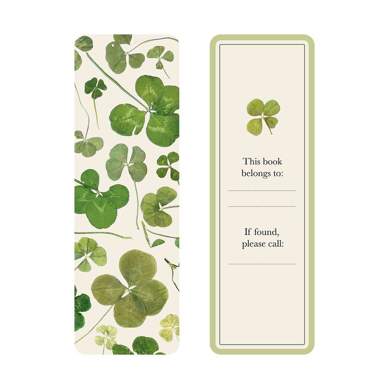 A bookmark with pressed clover design on one side and a place for personalization on the other.