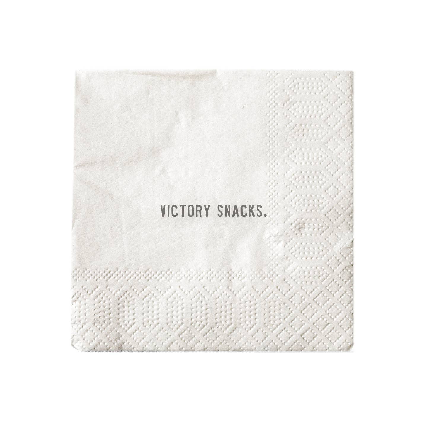 White cocktail napkin printed with "Victory Snacks."