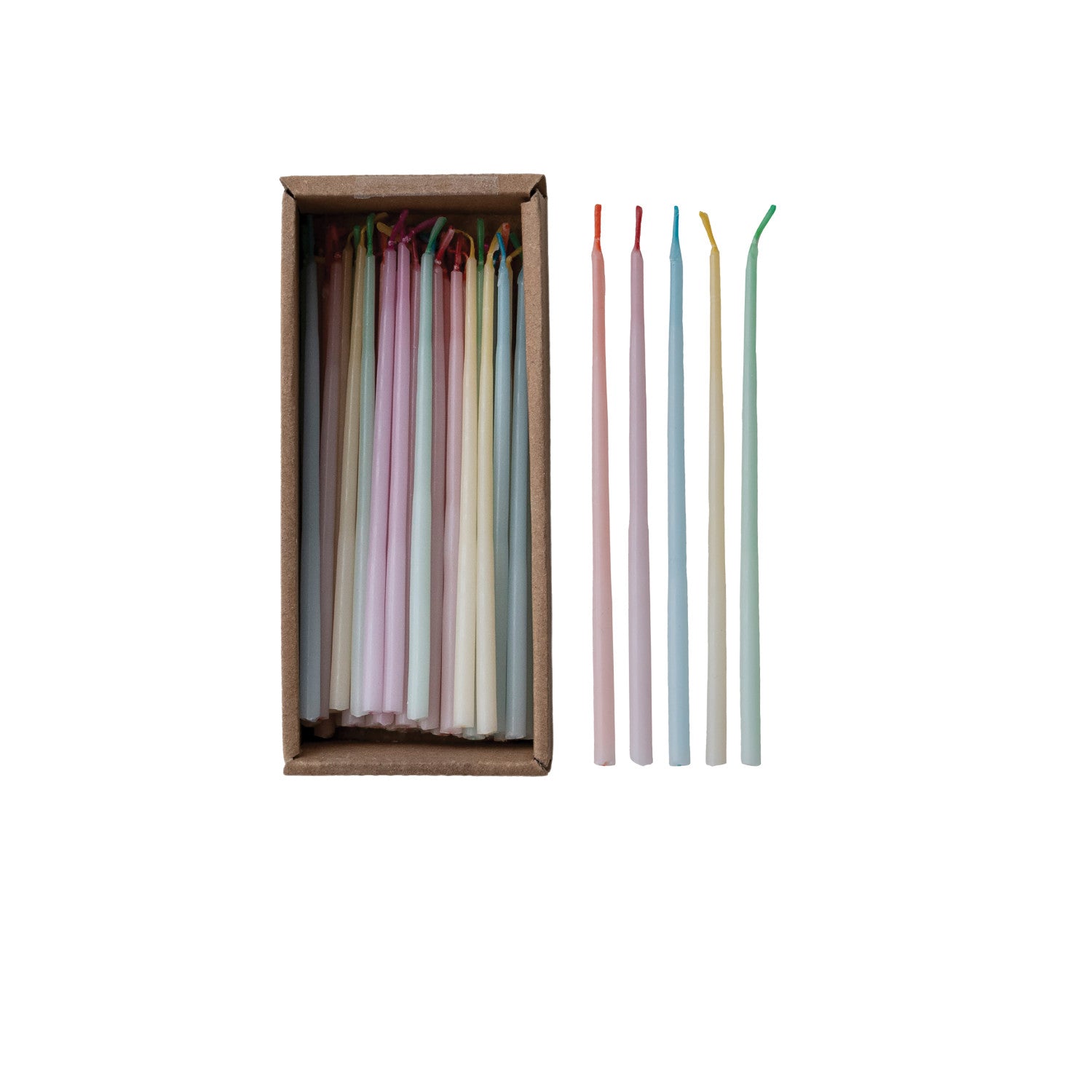 Set of colorful candles in a wooden box on a white background