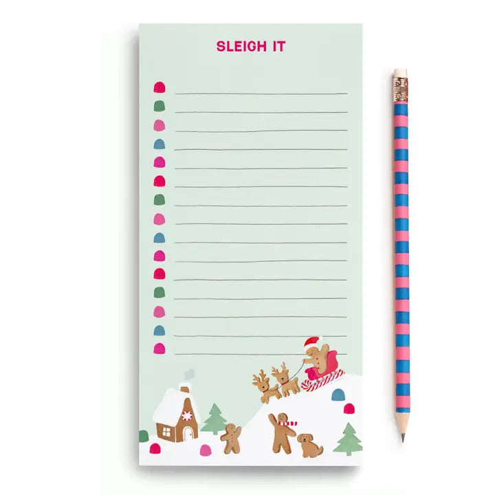Notepad with Christmas design and pencil on a white background