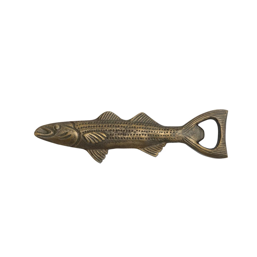Bronze fish-shaped bottle opener on a white background.