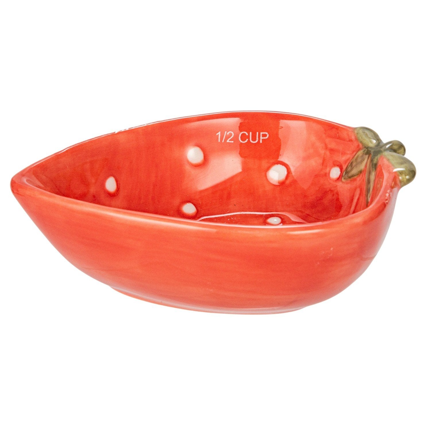 Red ceramic measuring cup shaped like a strawberry with measurement markings on a white background.
