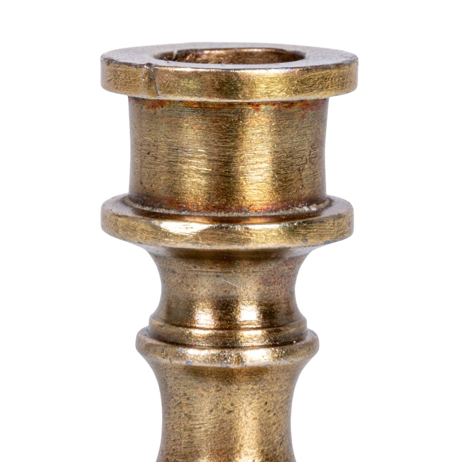 Brass candle holder on a white background.