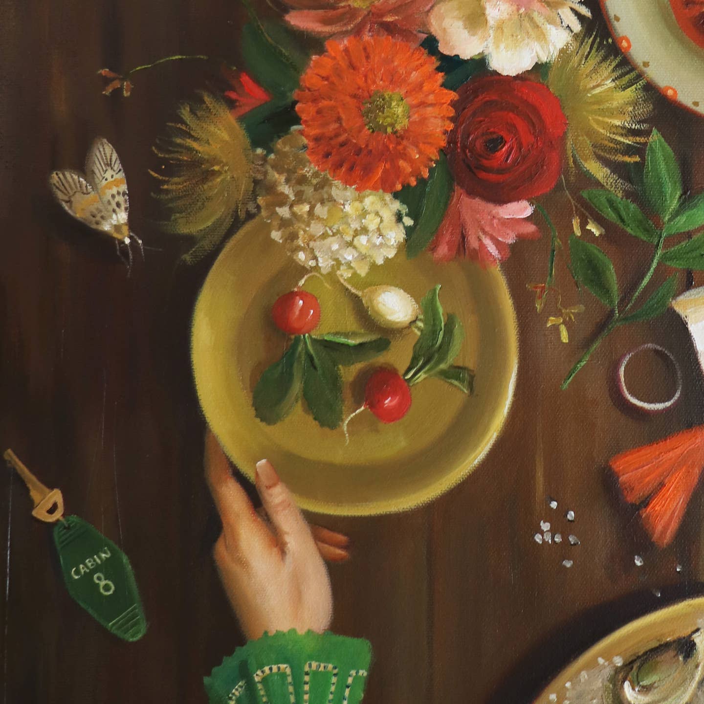 Artwork by Janet Hill depicting a table set with plates of summer food and a lobster and fish.