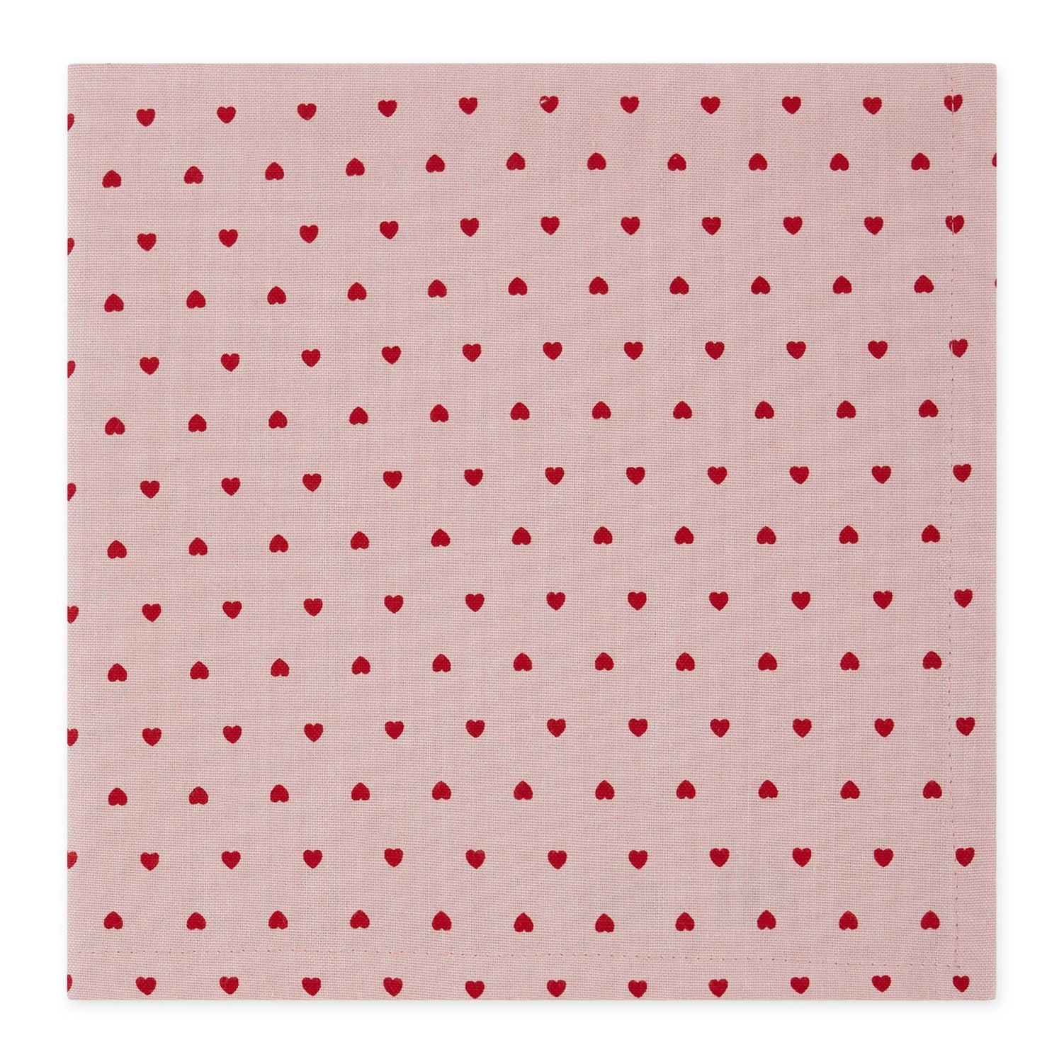A square pink fabric napkin with a repeating pattern of small red hearts, shown flat against a white background.