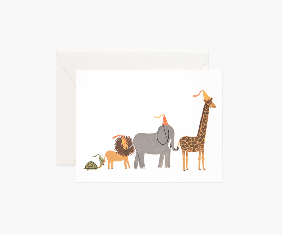Greeting card featuring illustrations of a turtle, lion, elephant, and giraffe on natural white cover paper from Rifle Paper Co.&