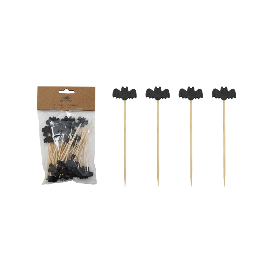 Black bat-shaped skewers with packaging on a white background.
