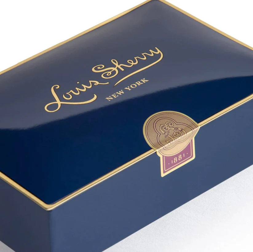 Louis Sherry New York box with gold text and emblem on a white background