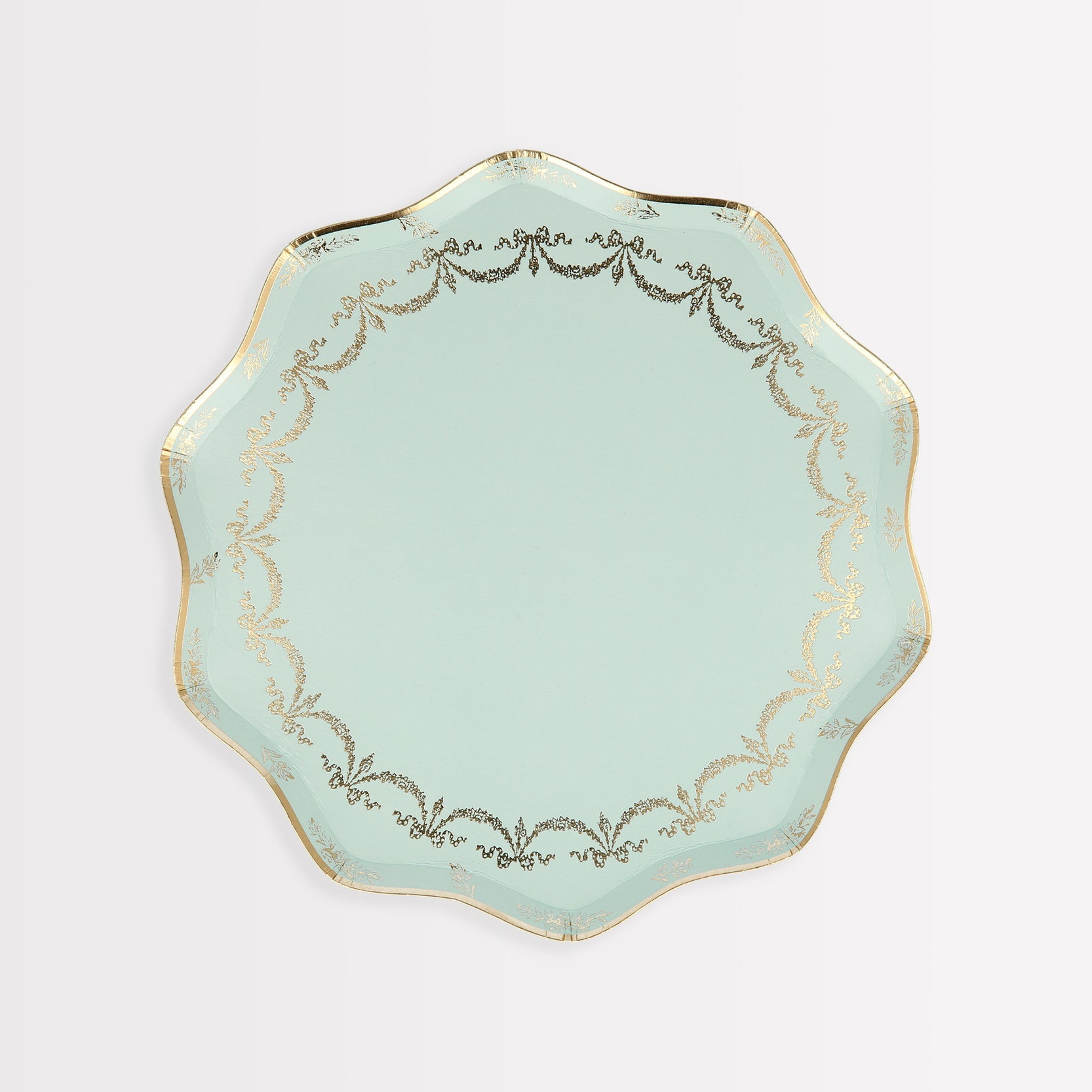 A Ladurée Paris Paper Plate with gold trim by Meri Meri.