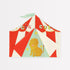 Red and white circus tent paper design with a lion illustration on Meri Meri&